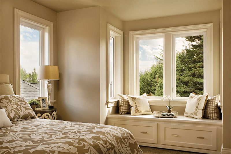 casement windows in a bedroom allowing controlled ventilation, natural light, and energy efficient comfort for a Wilmington coastal home
