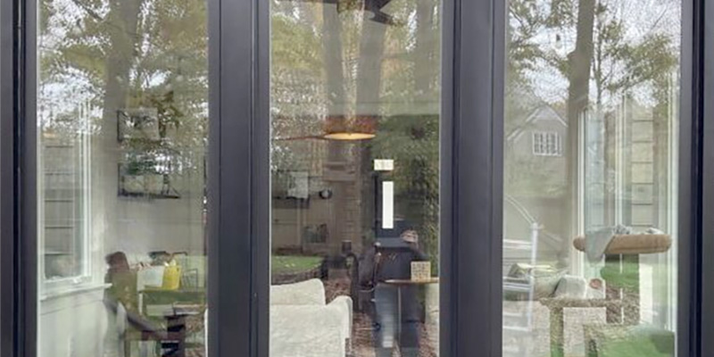 Coastal Performance Considerations large window configuration with fixed glass panels creating expansive views and clean modern design with professional installation