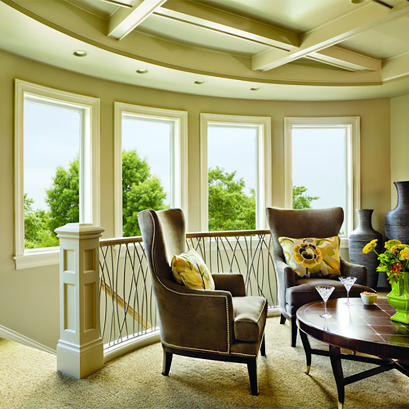 bay style picture windows installed in a curved wall to maximize natural light and outdoor views with energy efficient performance in a coastal Carolina home