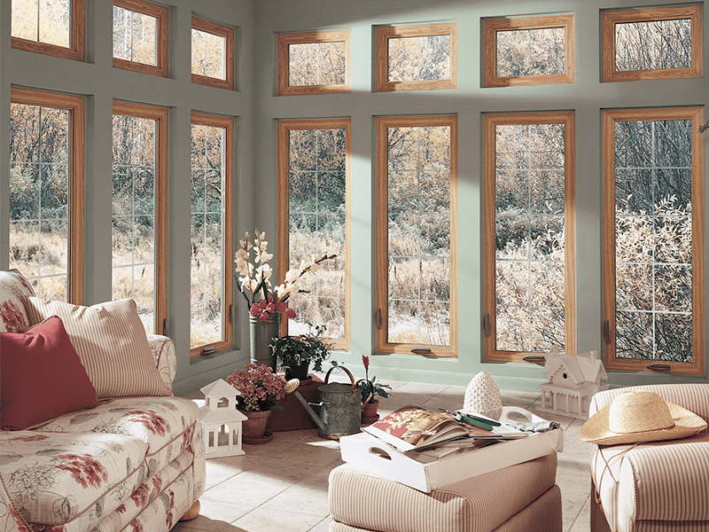 combination windows with fixed picture windows and operable casement windows creating expansive views, natural light, and energy efficient performance
