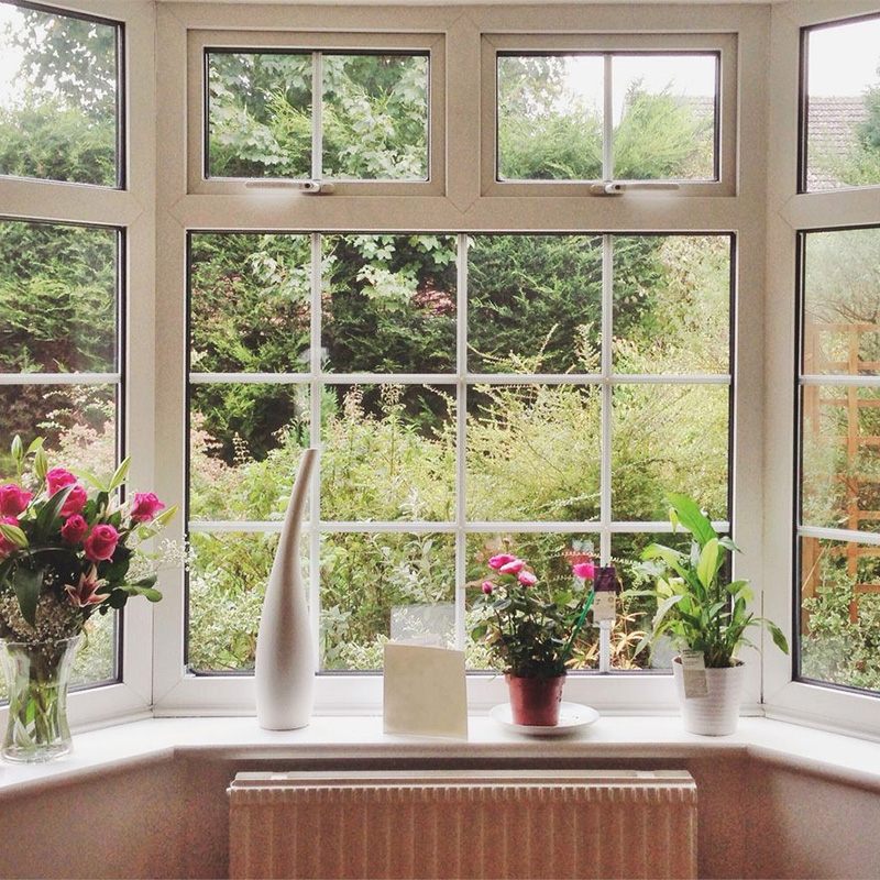 large multi pane window bringing in natural light while maintaining clear views and energy efficient sealing for everyday living in coastal Carolina home