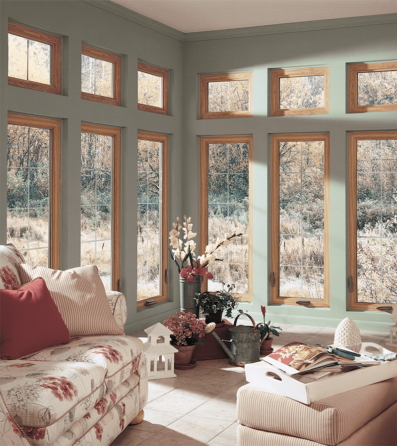 custom window configuration with large fixed and transom windows increasing natural light and improving energy performance in coastal Carolina home