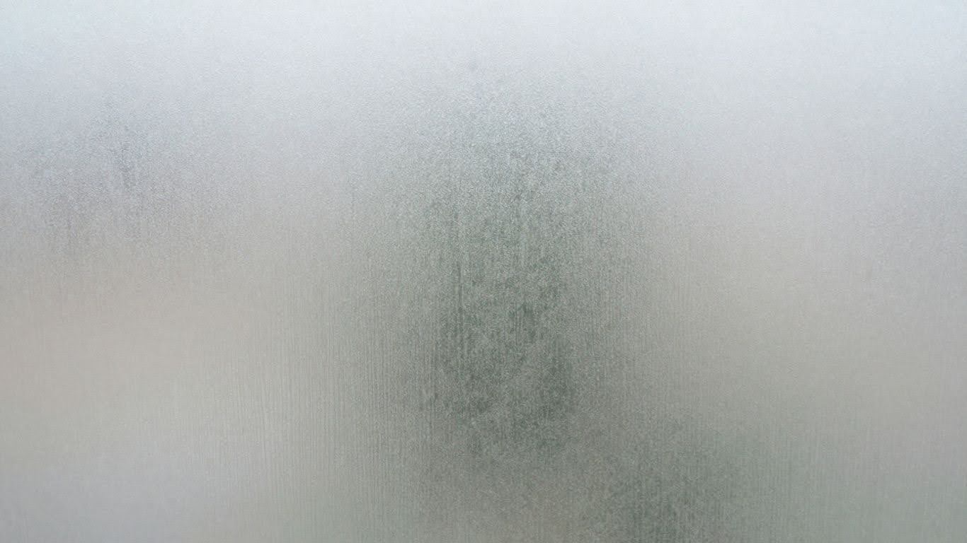 Frosted glass texture on a window pane.