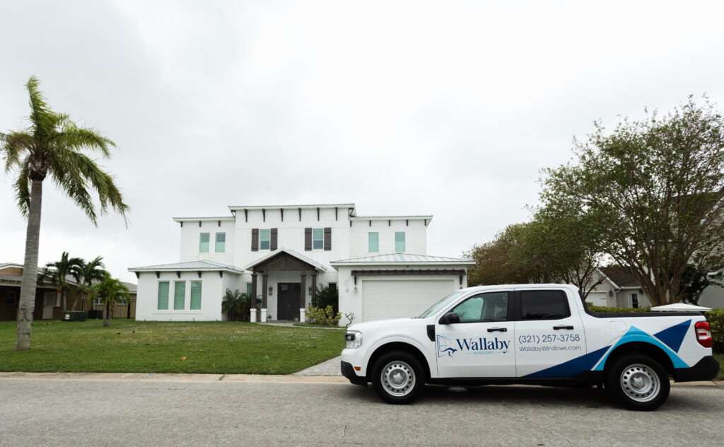 Wallaby Windows service van parked outside an Apex NC home as part of the Pane-Free Guarantee program