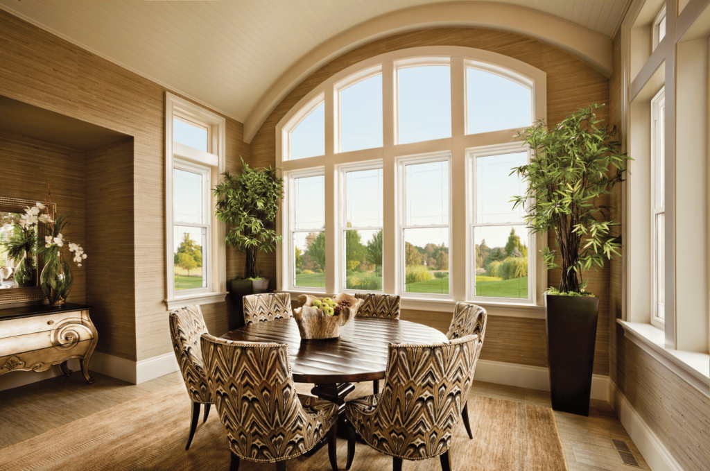 Dining room with large arched replacement windows installed by Wallaby Windows in Raleigh NC