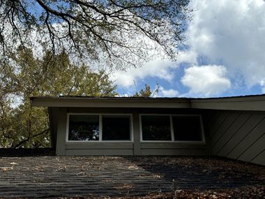 Home exterior with new energy-efficient transom windows