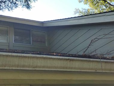 Outdated exterior transom windows before replacement